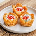 Crushed potato gem cups are a perfect vessel for caviar and creme fraiche.