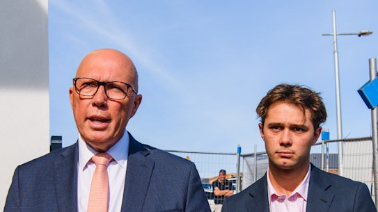 Opposition leader Peter Dutton visits a home under construction in Maddingley in the division of Hawke with son Harry by his side.  