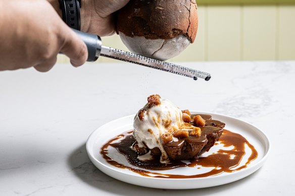 The salt is shaved over the dessert.