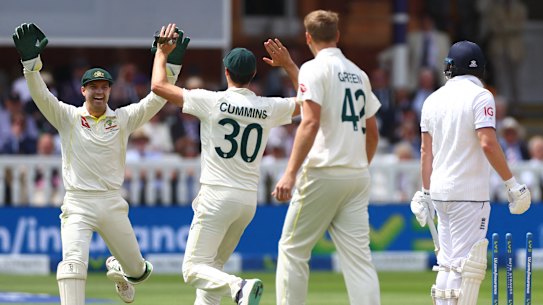 Alex Carey and Pat Cummins celebrate Jonny Bairstow’s wicket.