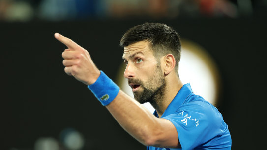 Novak Djokovic makes a point to the crowd on Friday night.