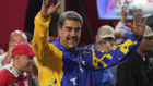 President Nicolas Maduro addresses supporters gathered outside the Miraflores presidential palace after electoral authorities declared him the winner. 
