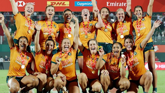 Australian players after winning the Dubai Sevens. 