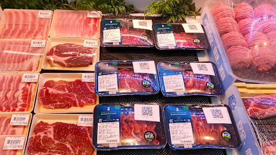 Beef products from New Zealand with a QR-code linked to package goods coronavirus test results are displayed at a supermarket in Beijing.