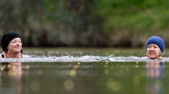 Meg Elkins (left) and Holly Jones swim in the Yarra at Deep Rock, the bend in the river before Dights Falls in Abbotsford. 