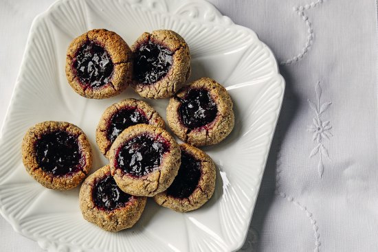 Flourless hazelnut cookies with wattleseed and cherry.