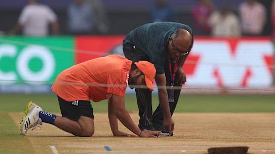 Rohit Sharma inspects the pitch at Wankhede Stadium in Mumbai at a training session this week.
