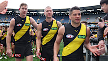 Dion Prestia and Nathan Broad walk off the field.