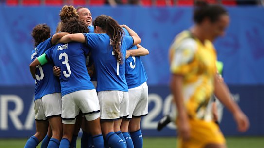 Italy celebrates winning their opening World Cup match against Australia.