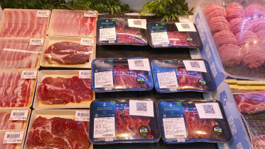 Beef products from New Zealand with a QR-code linked to packaged goods coronavirus test results are displayed at a supermarket in Beijing.