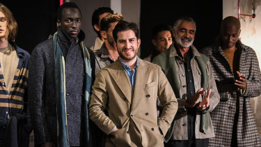 Designer Christian Kimber (centre) on the runway with models during Fashion Week 2021.