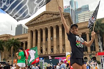 Stilt walkers grabbed the attention at the NRL Fan Day in Brisbane King George Square on Thursday.