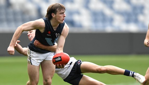 Ollie Hollands, pictured tackling George Wardlaw, is in Carlton’s sights. 