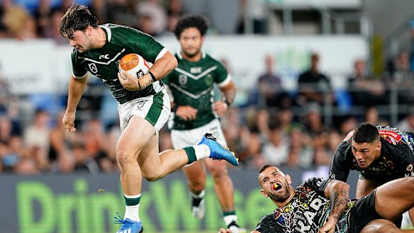 Brandon Smith of the Maori Kiwis breaks free at CBus Super Stadium on the Gold Coast.