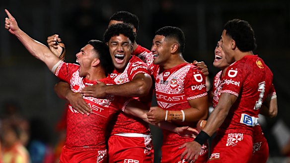Tonga players celebrate a try in their upset win over New Zealand to reach the Pacific Championships rugby league final in 2024.