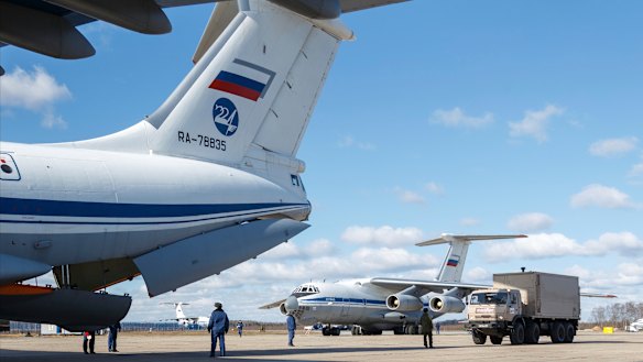 Nine Il-76 cargo planes are loaded at the Chkalovsky military airport in Moscow as Russia prepares to send medical personnel and supplies to Italy to help the country's efforts against the coronavirus. 
