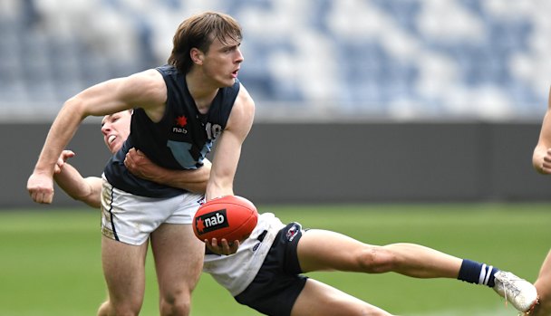 Ollie Hollands, pictured tackling George Wardlaw, is in Carlton’s sights. 