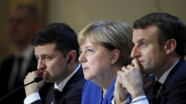 German Chancellor Angela Merkel, centre, with Ukraine's President Volodymyr Zelenskiy, left, and French President Emmanuel Macron in early December.