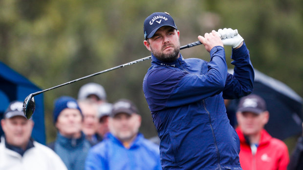 Cold, wet and wild: Marc Leishman competes for Australia in the World Cup of Golf.