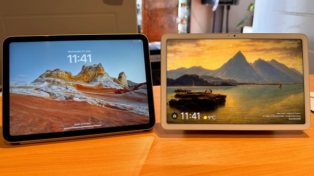 The 10th Gen iPad, left, next to the Pixel Tablet in its dock.