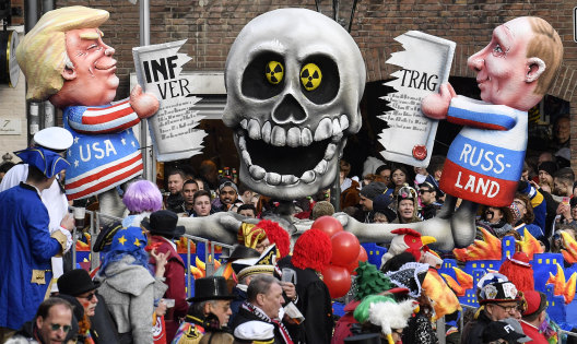 A carnival float depicts Donald Trump and Vladimir Putin cutting the INF (Intermediate-Range Nuclear Forces) Treaty during the traditional carnival parade in Duesseldorf, Germany, last week. The US's new budget has allowances for increased nuclear capability.