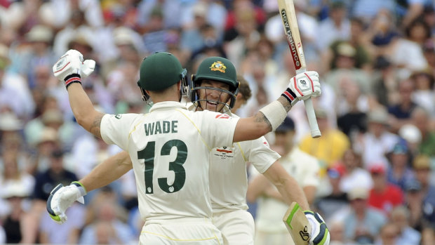 Nice innings, shame about the shirt: Matthew Wade celebrates his century with Tim Paine.