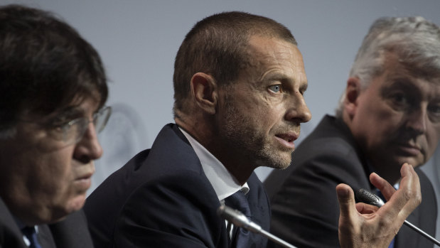 UEFA president Aleksander Ceferin, centre, says priority must go to finishing domestic leagues.