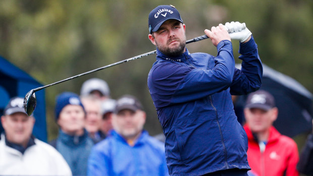 Cold, wet and wild: Marc Leishman competes for Australia in the World Cup of Golf.