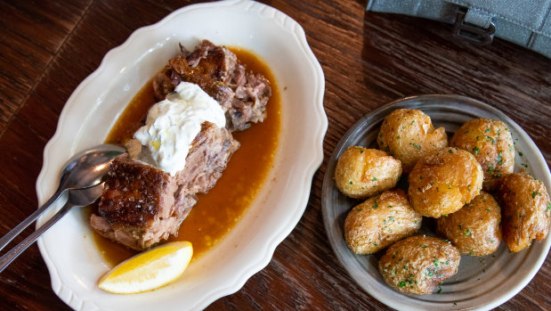 Oven-roasted lamb chops with lemon and Greek yogurt, and garlic baked potatoes.