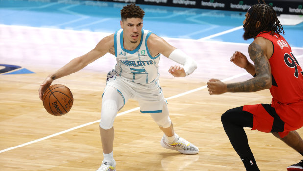 LaMelo Ball surges forward for the Charlotte Hornets against the Toronto Raptors.