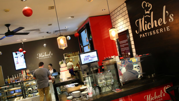 Retail Food Group, owner of Michel's Patisserie, has seen its profits drop over 50 per cent.