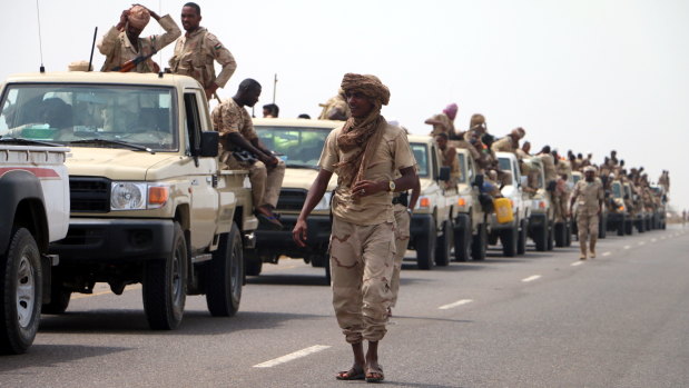 Sudanese forces fighting alongside the Saudi-led coalition in Yemen gather near the outskirts of the western port city of Hodeidah on Tuesday.