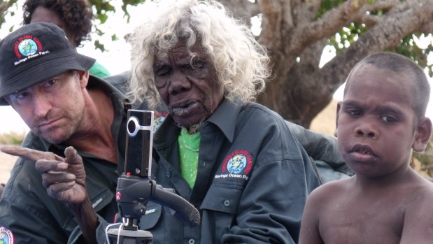 The late Laurie Baymarrwanga, Bentley James and Clint watching dance at Murrungga Island in 2009. 