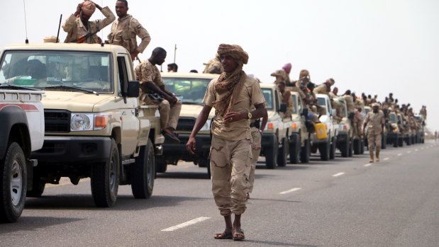 Sudanese forces fighting alongside the Saudi-led coalition in Yemen gather near the outskirts of the western port city of Hodeidah on Tuesday.