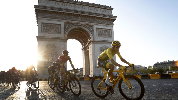 On his way to winning the Tour de France last year, Colombia's Egan Bernal rides past the Arc de Triomphe on the Champs-Elysees last year.