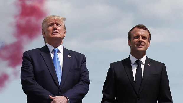 U.S President Donald Trump and French President Emmanuel Macron attend a ceremony to mark the 75th anniversary of D-Day at the Normandy American Cemetery in Colleville-sur-Mer in France  on Thursday.
