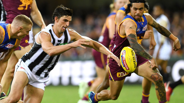 Top flight: Magpies captain Scott Pendlebury in action against the Lions.