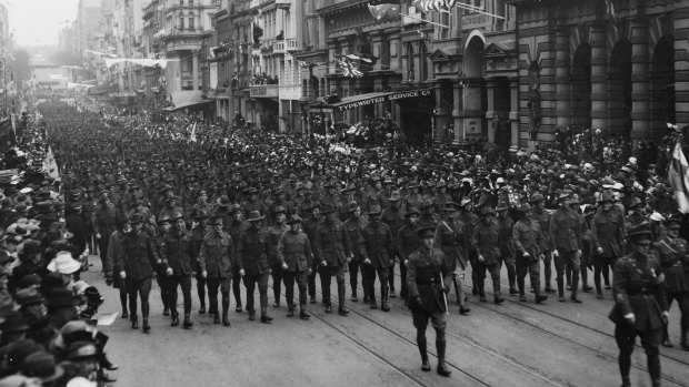 Soldiers march along Collins Street on Peace Day.