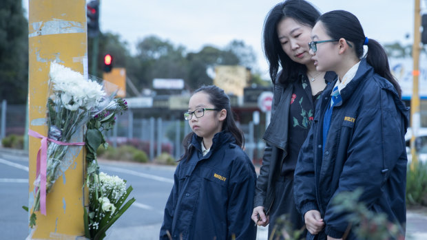 Cheryl Liu and daughters Grace and Debbie pay tribute to 14-year-old schoolgirl Aivy Nguyen.