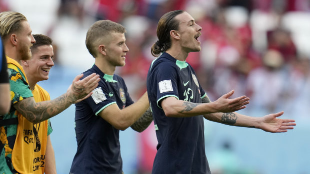 Jackson Irvine and the Socceroos celebrate the Socceroos’ win.