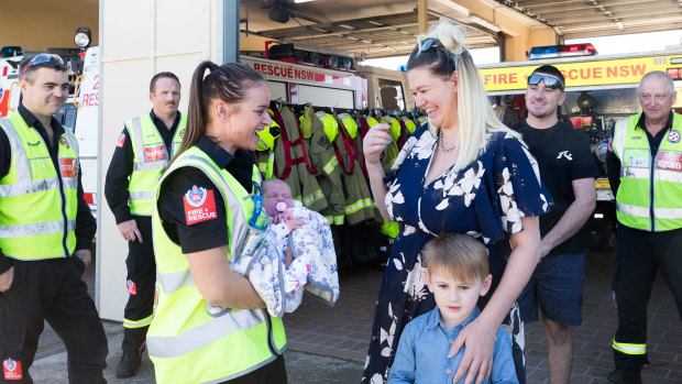 Ms Korn, her four-year-old son Dylan and her new baby Arley are reunited with firefighters who assisted her delivery