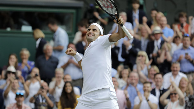 Roger Federer celebrates defeating Rafael Nadal during their semi-final.