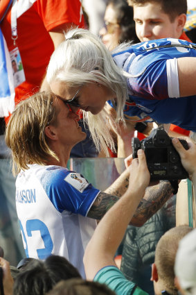 Iceland's Ari Skulason celebrates with a woman afterwards.