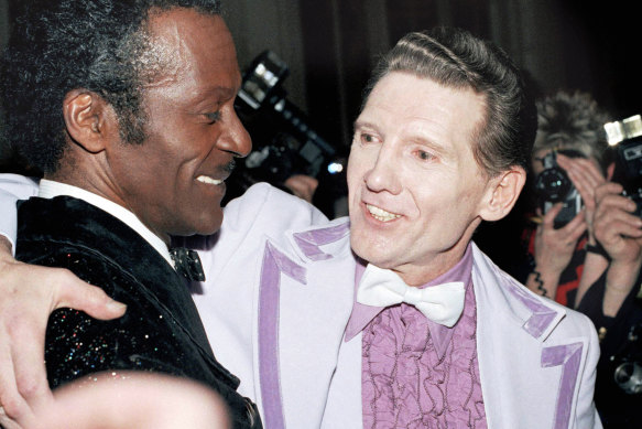 Chuck Berry (left) and Jerry Lee Lewis embrace at a reception at the Waldorf-Astoria in New York in 1986.