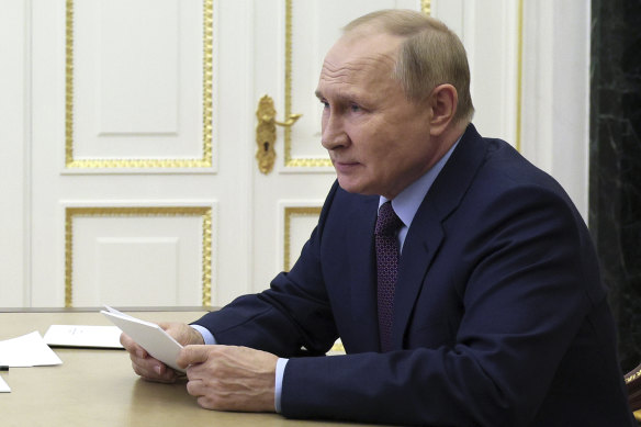 Russian President Vladimir Putin chairs a meeting on economic issues via teleconference call in Moscow.