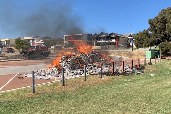 A garbage truck was forced to empty its load in a parking lot in East Fremantle after the contents caught fire yesterday.