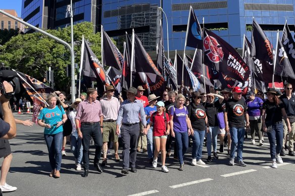 Premier Steven Miles with daughter and fellow state MPs leads the annual Labour Day March in Brisbane this morning. 