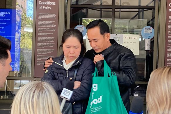 Ngoc Thanh (right) leaves the Melbourne Magistrates’ Court on Thursday with his wife.