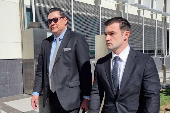 Ryan Bayldon-Lumsden (right) walks next to his legal team outside Southport Courthouse.