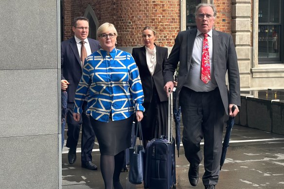 Senator Linda Reynolds arriving in court with her lawyer, Martin Bennett.